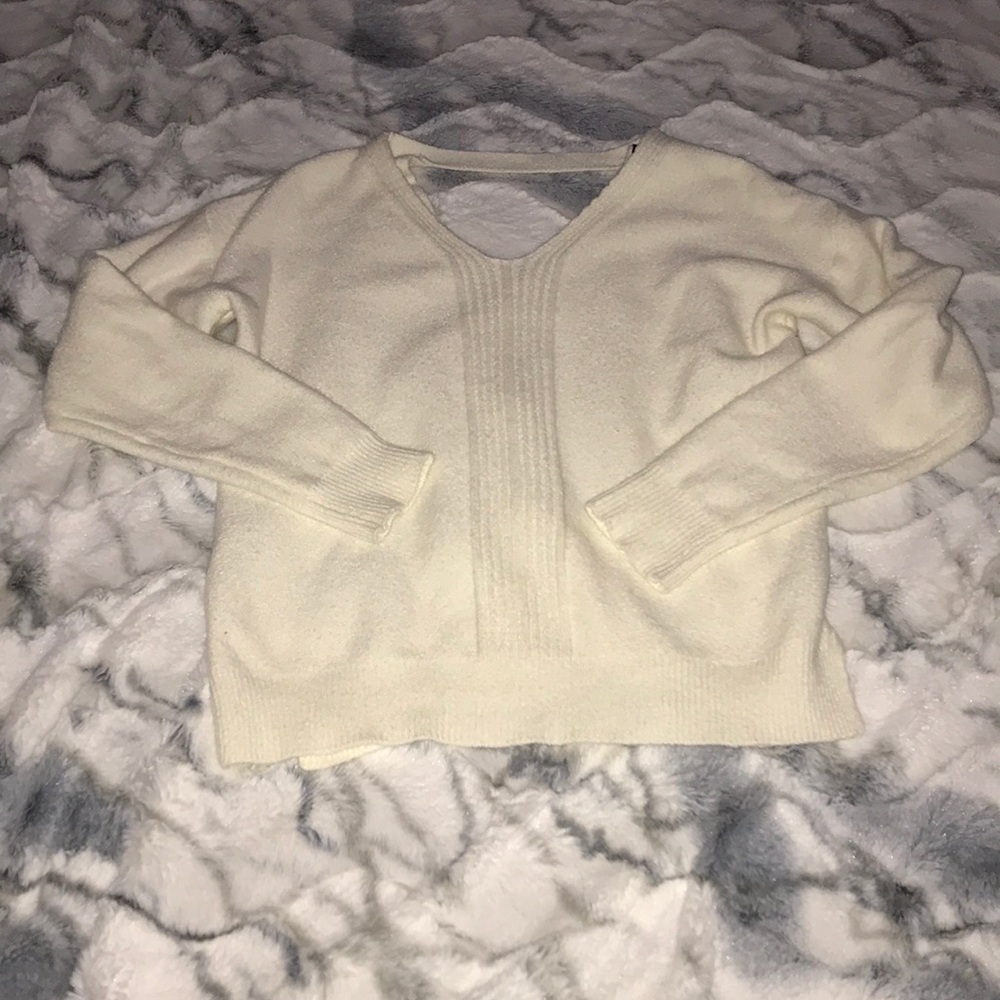 White sweater with slightly opened back